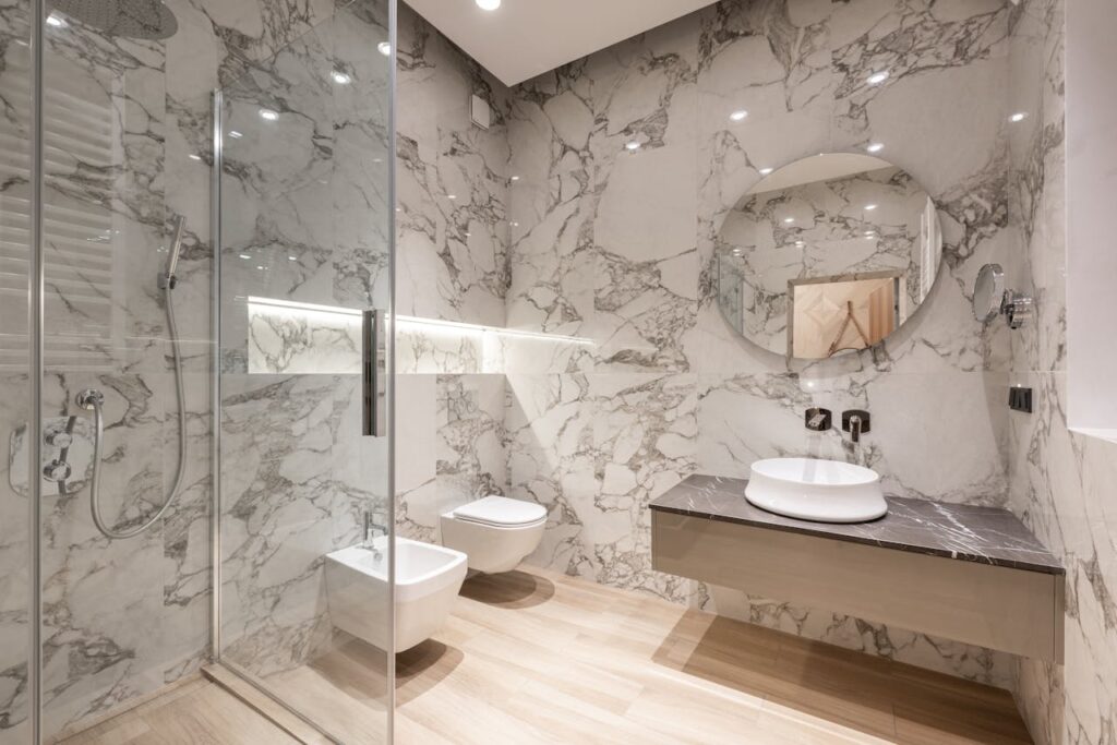 pexels-photo-6585753 Bathroom interior with bidet and toilet near sink and shower